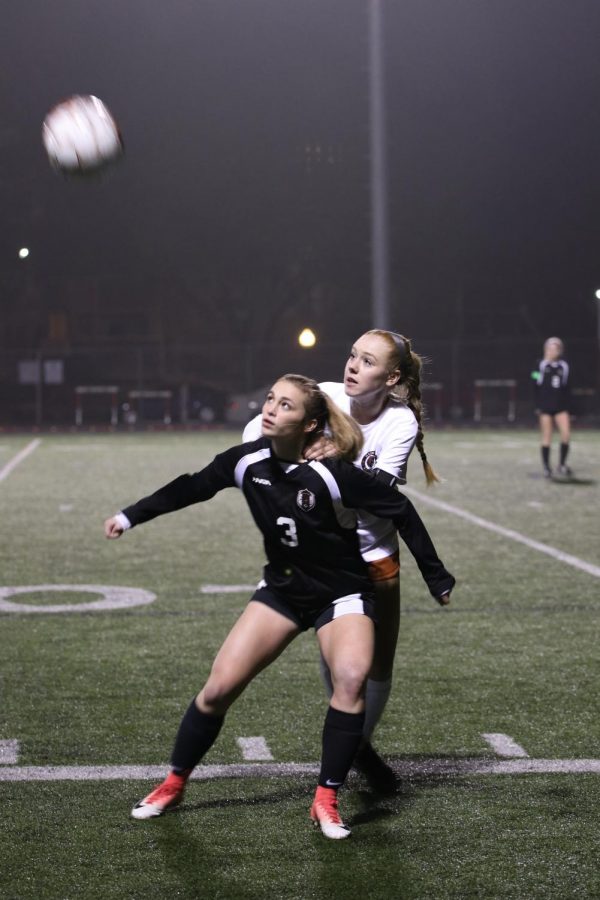 Caroline Gillispie 18 gets ready to jump up and head the ball. 