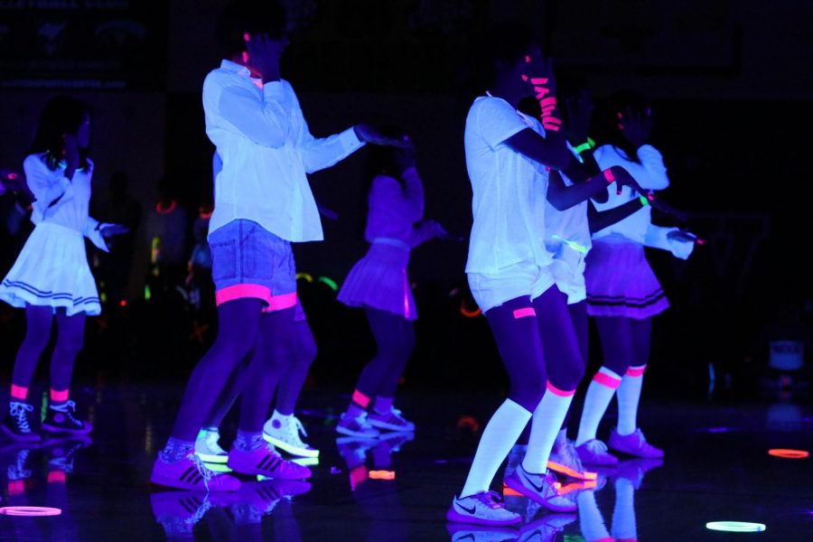 K-Pop club puts on an electrifying dance routine. 