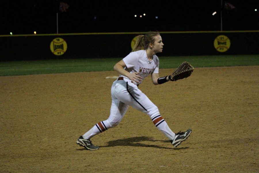 Lizzie Taylor 18 keeps her eyes on the ball while guarding third base.