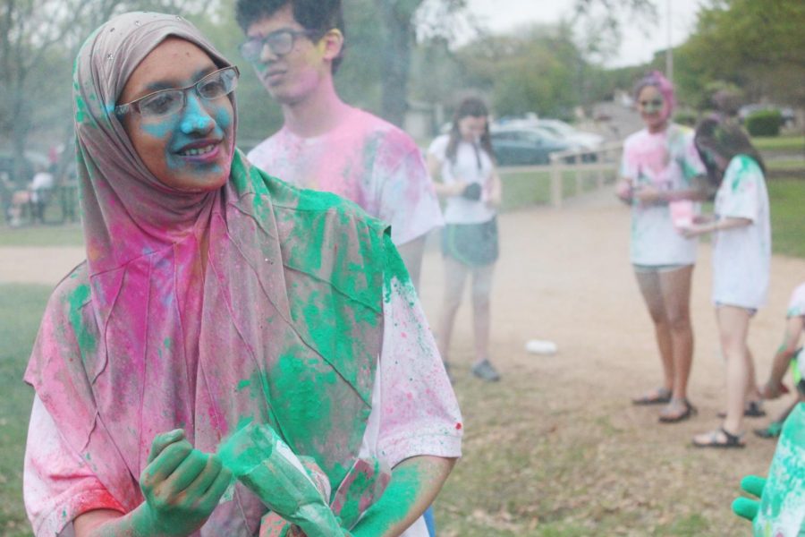 Nisha Seyed 19 looks at a classmate who just threw colored powder at her.