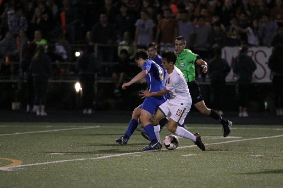Caden Popps 18 fights to maintain possession of the ball.