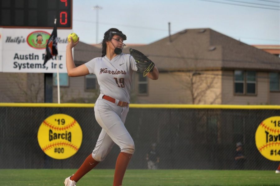 Sofia Figeroa 19 throws the ball back to the pitcher. 