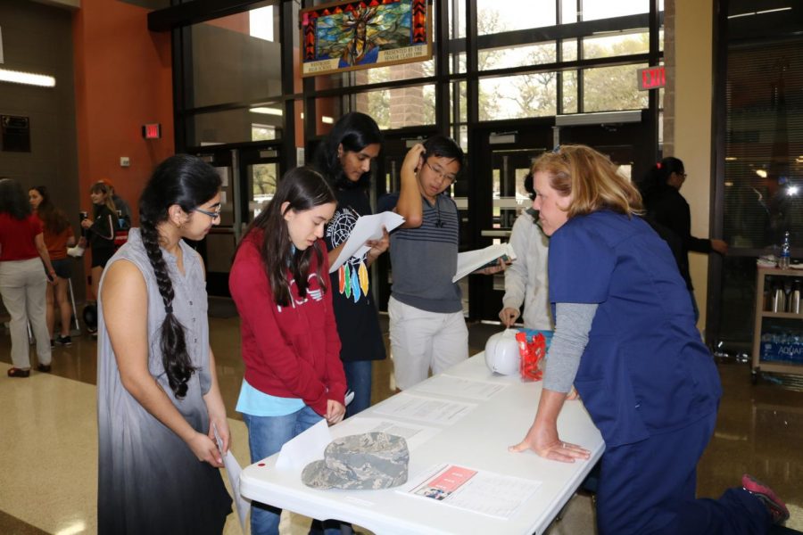 A group of students learns about CPR.