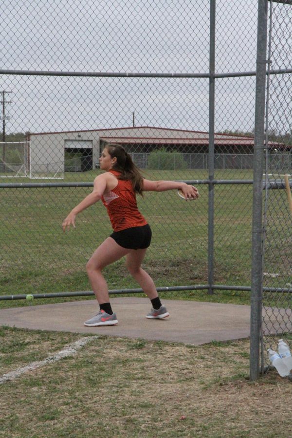 Abigail Gregorczyk 21 throws the discus.