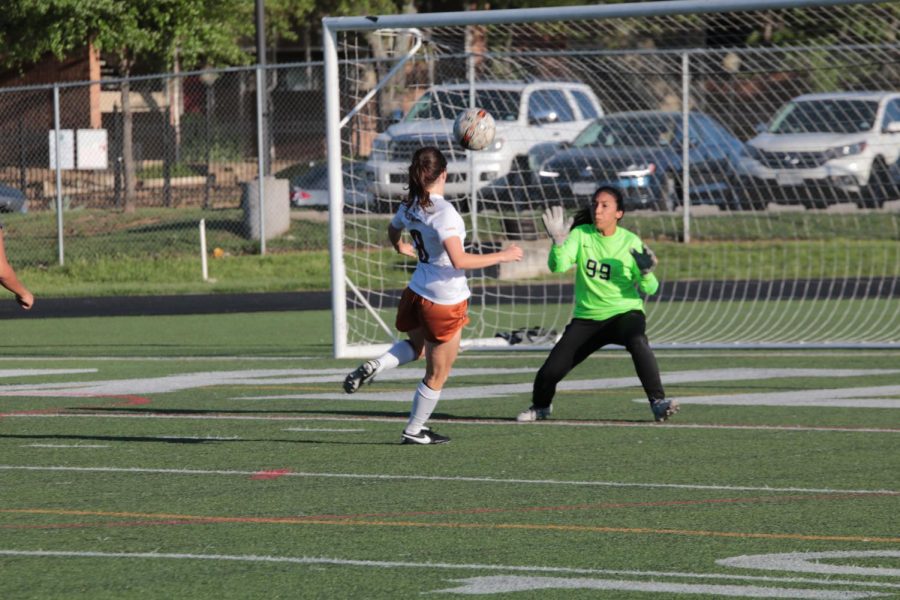 Madison Larrea 19 shoots and scores a goal as the goalie stands dumbfounded. 