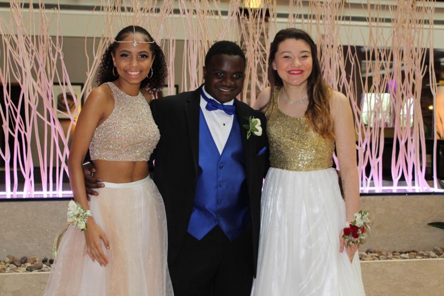 Julian Miller 18 poses with Zoë-Marie Johnson 18 and Caitlin Hernandez 18  after dancing.