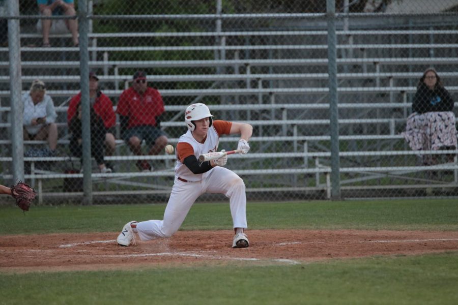 Ian Cox 19 attempts to bunt the Panthers pitch.