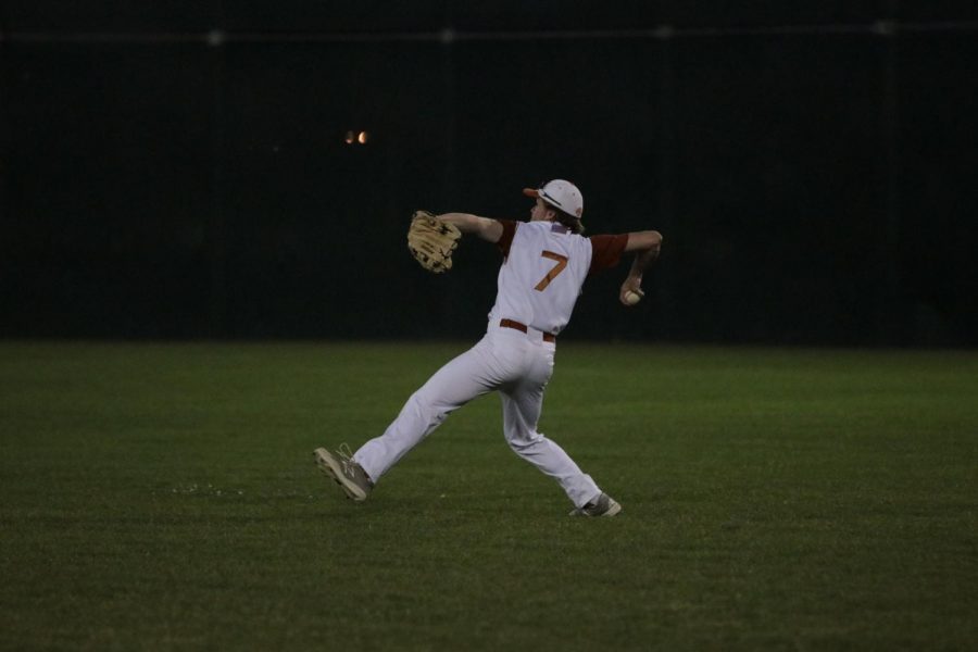 Trevor Kearsey 18 throws the ball back towards the bases after a hit to right field.