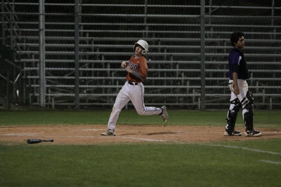 Jace Lyne 20 makes it to home base to score.