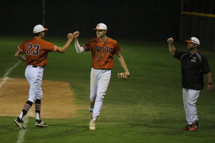 Mason Flood 19 and Nathan Potter 20 fist pump after a successful play.