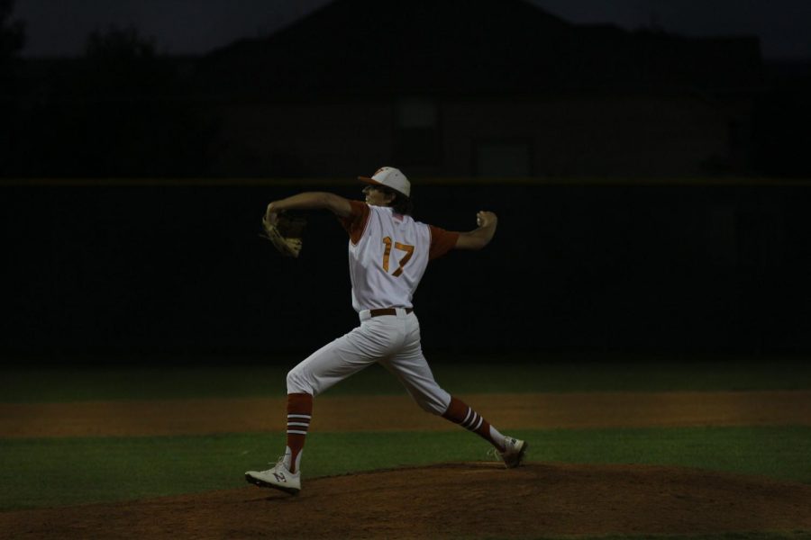 Nick Manasso 18 pitches the ball.