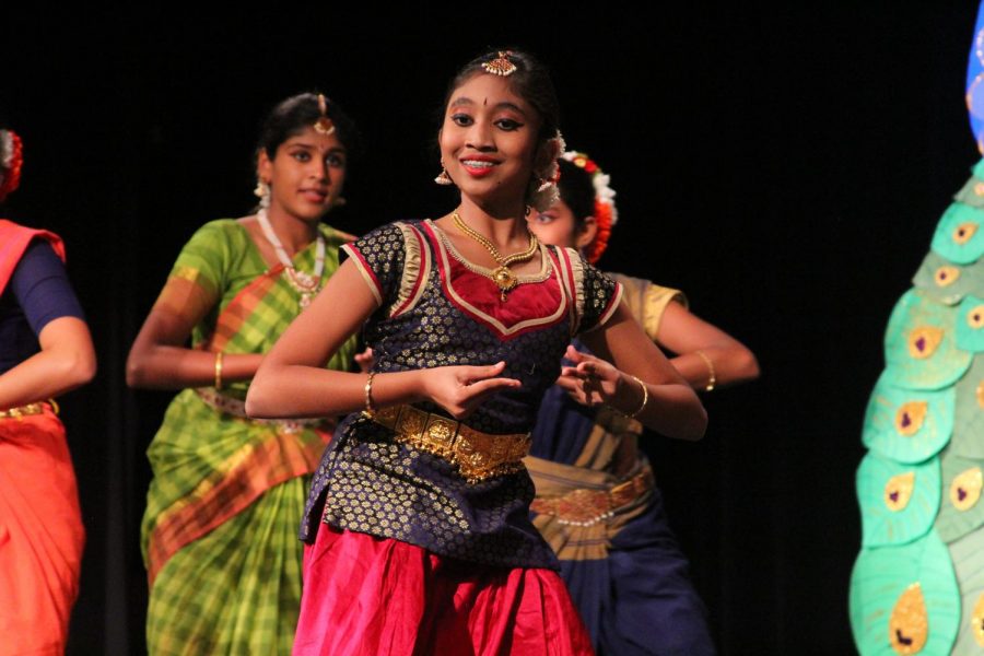 A dancer smiles at the audience.