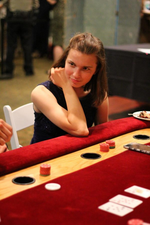 Anna Stankes 19 observes the poker game. 