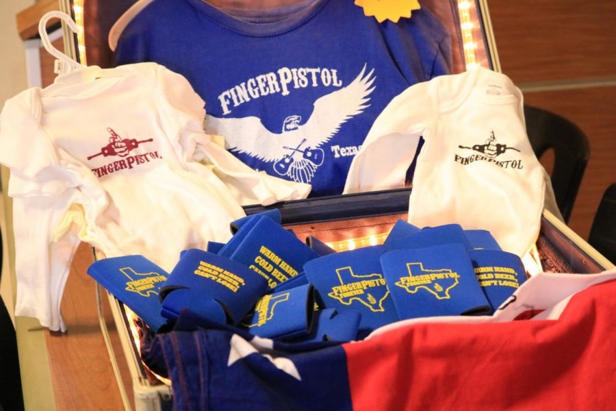 Fingerpistol merchandise is displayed for sale. 