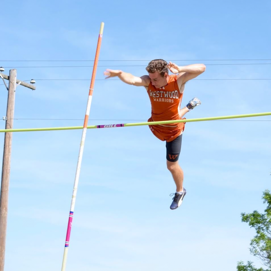 Tristan Yates 18 pushes the pole after clearing the cross bar. Photo courtesy of Dillon Todd.