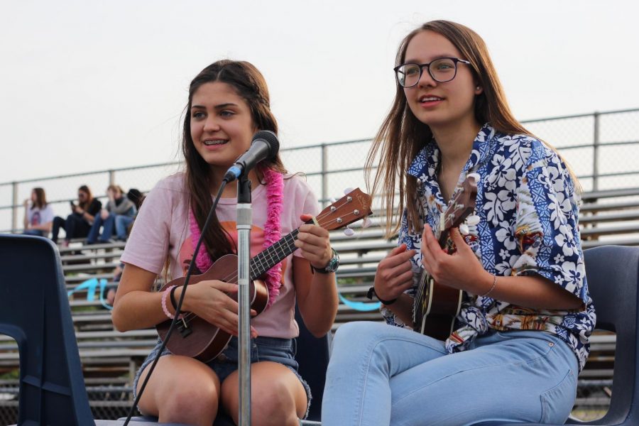 Students play a song for the audience.