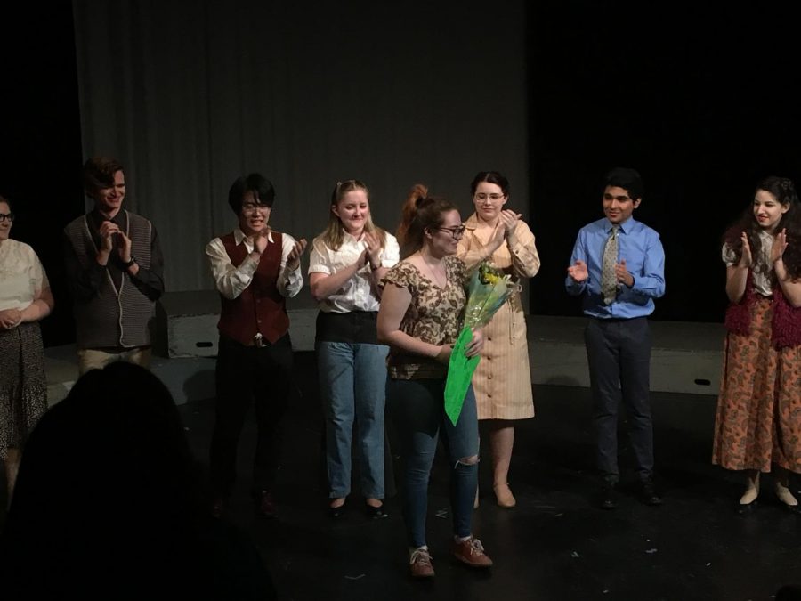 The cast of Missing Piece assembles on stage with their director.