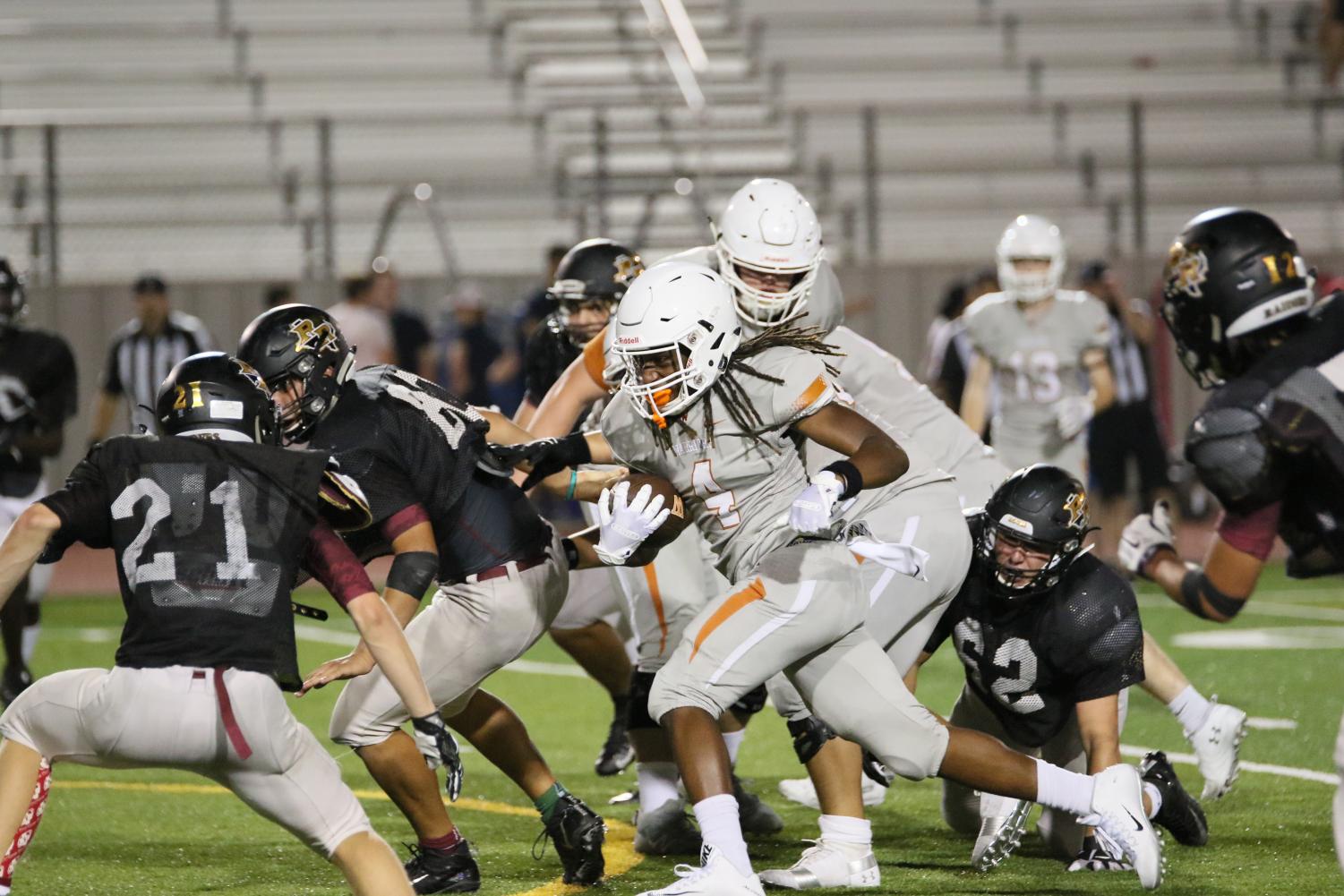 Varsity+Football+Faces+Off+Against+Rouse+Raiders+In+Scrimmage