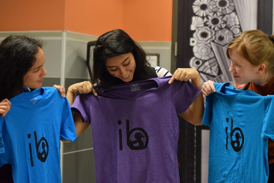 Sophomores Priyanka Gupta, Anouka Saha, and Violet Burns show off their newly made T-shirts. 