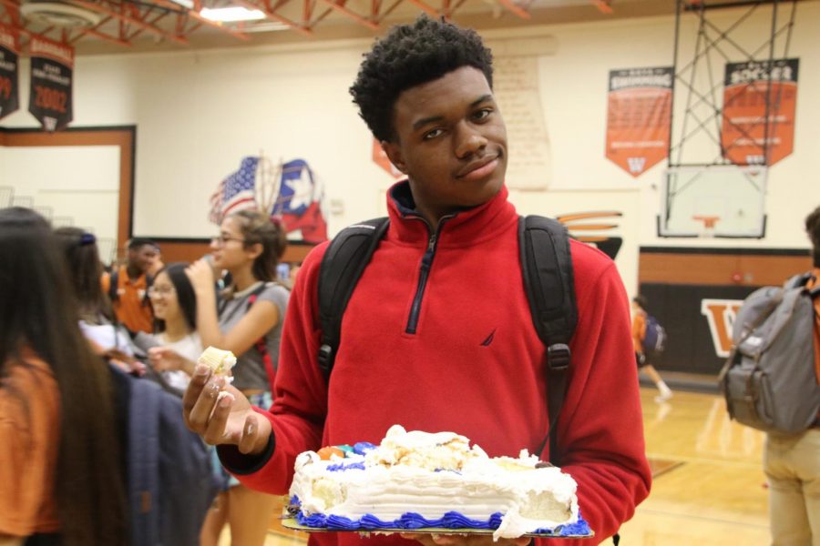 Brandon Parks 20 grabs a cake to take back to class.