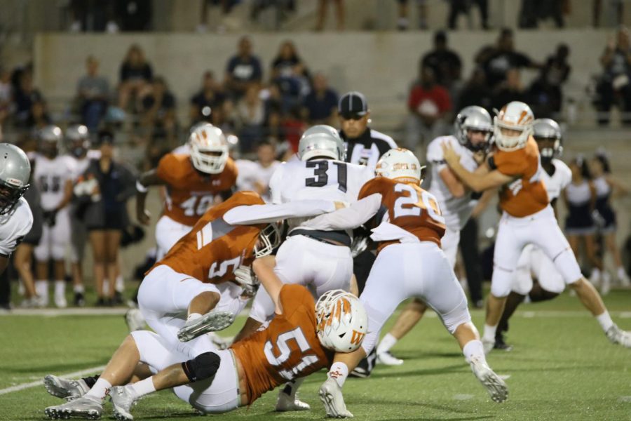 Nathan Potter '20, Josh Shoup '19, and Connor Cooper '20 work to bring down a Hendrickson player.