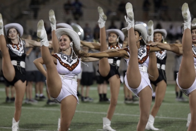 Gabby Hoover 20 and Susi Chavez 19 kick their legs up during the halftime performance.