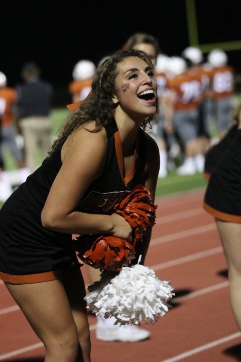 Kylie Allen 19 shakes her poms during a cheer.