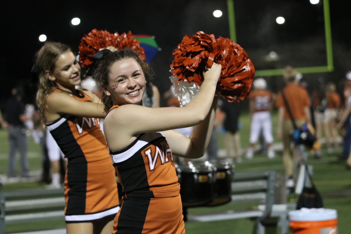 McKenna Stogdill 20 shakes her poms during a drum chant.