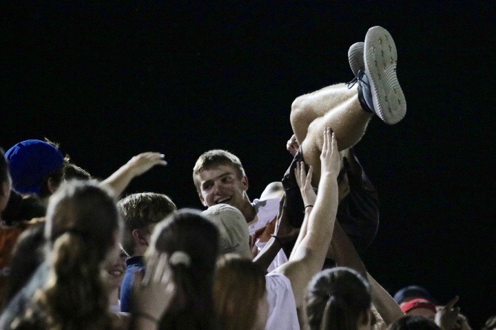 Zach Schrull 19 is lifted up by his friends to celebrate his birthday.