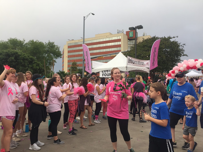 SunDancers, Warrior Pride and Cheer celebrate breast cancer survivors as they finish the race.