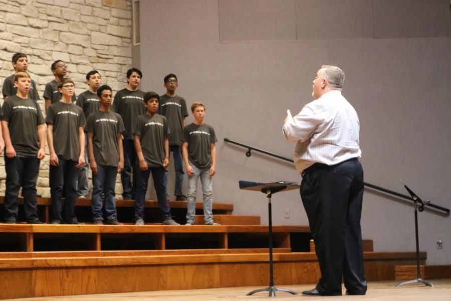 The concert mens choir sings as head director Andre Clarke conducts the song Let All Men Sing.