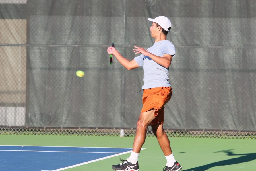 During the singles matches, Mohanad Elchouemi 19 forehands the ball.