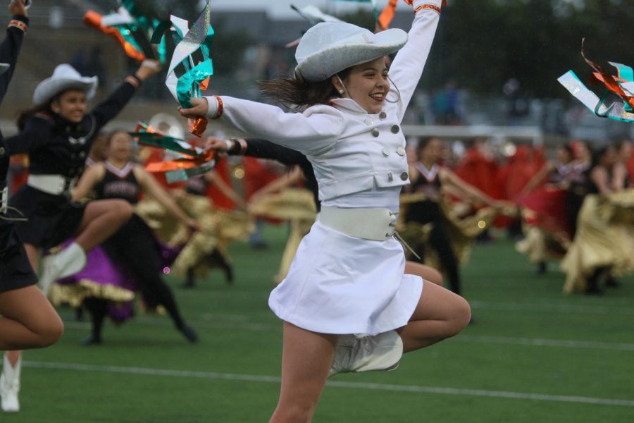 Hallie Klein 19 jumps and smiles as she performs during the halftime show.