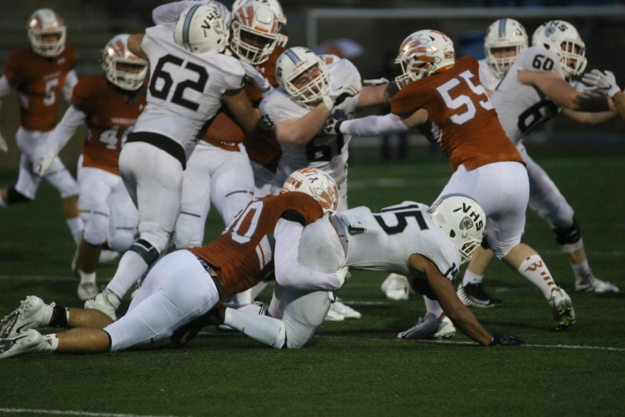 Ethan Brown 19 grabs and holds on to a Vandegrift running back to prevent the Vipers from gaining yardage.
