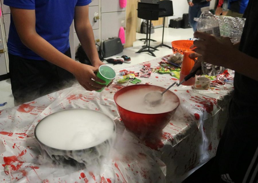 Dry ice punch bowls are provided for students during party.