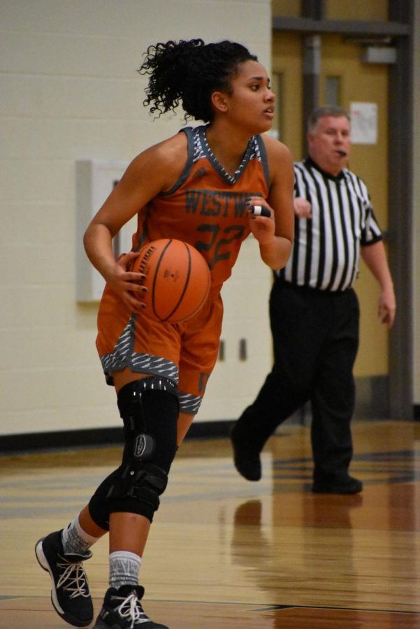 Makayla Coy 19 takes the ball down the court in a game against Hendrickson on Jan. 2.