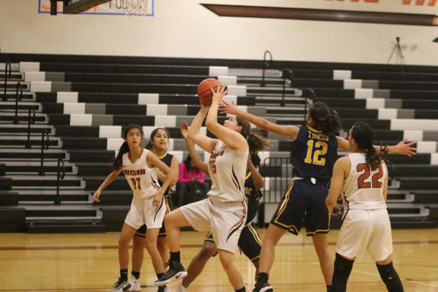 Emma Zion 21 cuts through the opposing defense to shoot. 