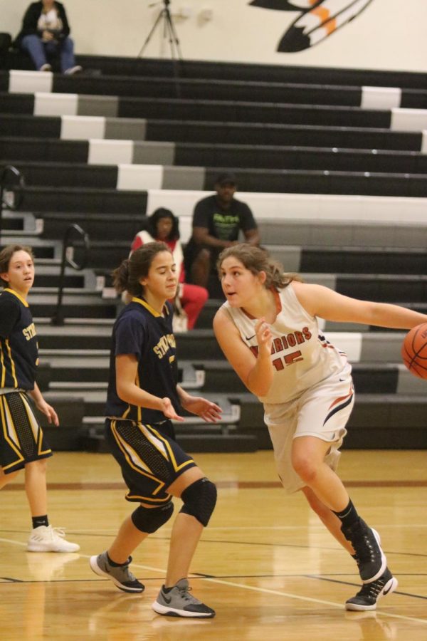 Emma Zion 21 cuts through the opposing defense for the basket. 
