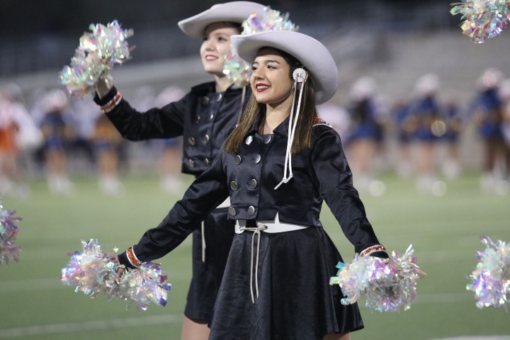 Jazelle Moreno 20 shakes her pompoms during the alma mater.