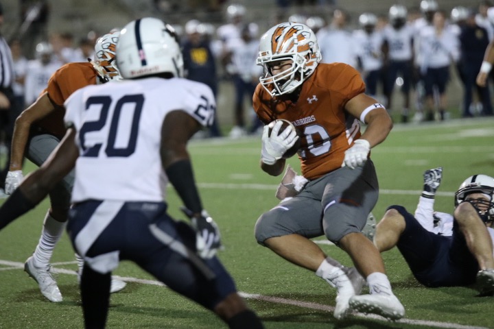 Robbie Jeng 21 tries to make his way upfield past a Stony Point player.