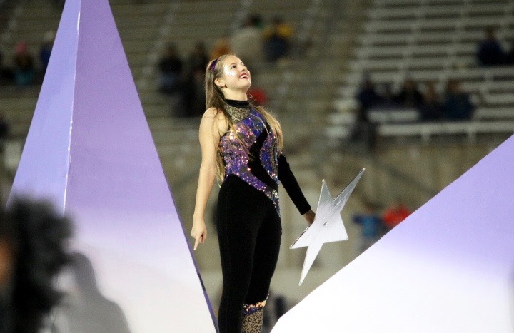Sarah Christman 20 poses while performing in the halftime routine.