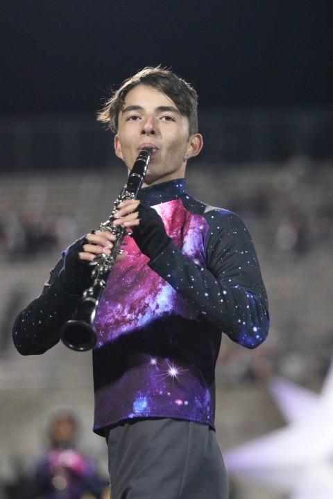 During bands halftime routine, Emilio Penny 20 plays the clarinet.