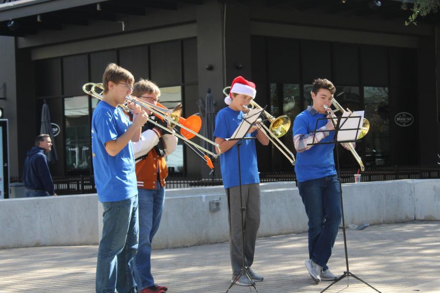 The trombones perform in their ensemble.