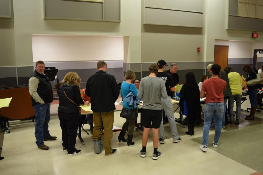 Baseball parents line up to register their sons. 