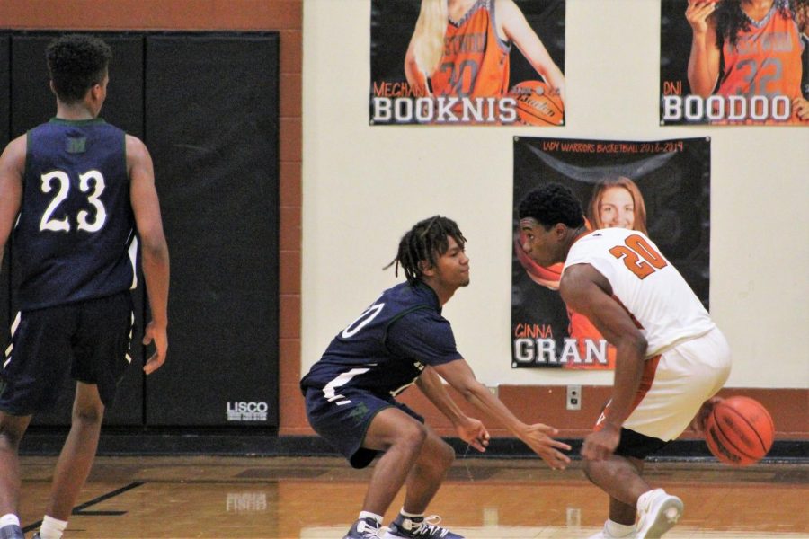 Brandon Parks 20 keeps the ball away from an opponent.