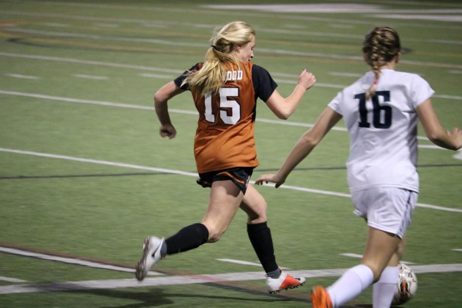 Eliza Kotick 22 chases down a McNeil player.