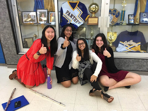 Sophomores Sanjana Kumar, Srilekha Cherukuvada, and Abigail Dewhirst, and freshman Jessica Hao pose for a picture before performing their solos.