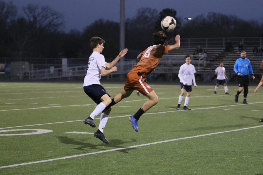 Max Wiele 21 jumps up to head the ball.