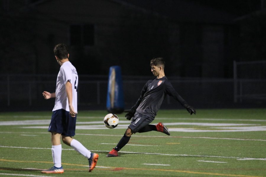 Following a save, goalie Emilio Penny 20 punts the ball.