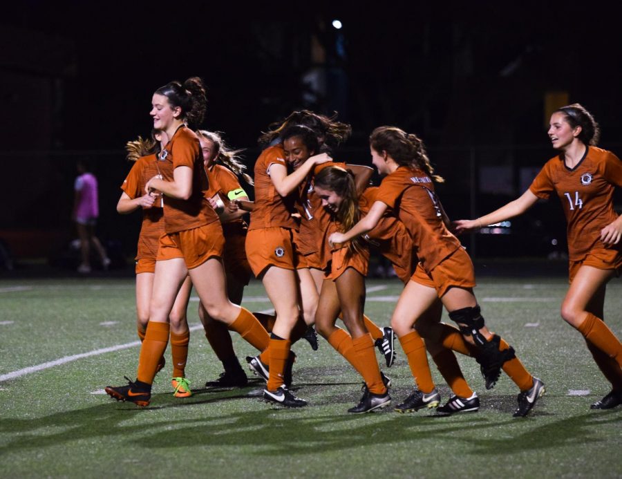 The team celebrates after Deepti Choudhury 21 scores a goal in a game against Hendrickson.